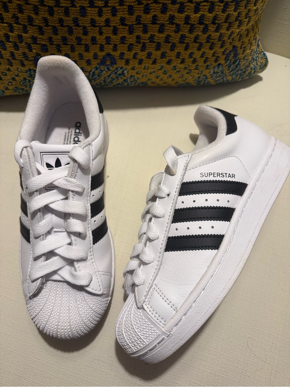 adidas Women’s Superstar Sneakers in White with Black Stripes